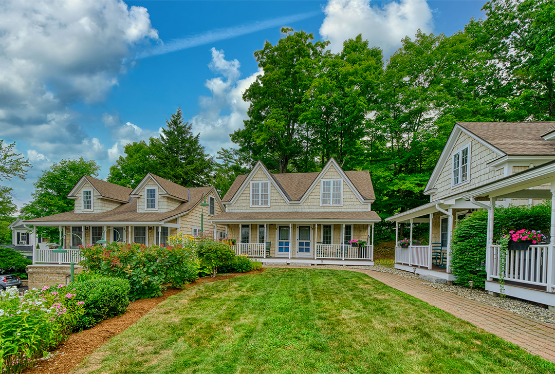 Sunapee Harbor Cottages in summer with flowers